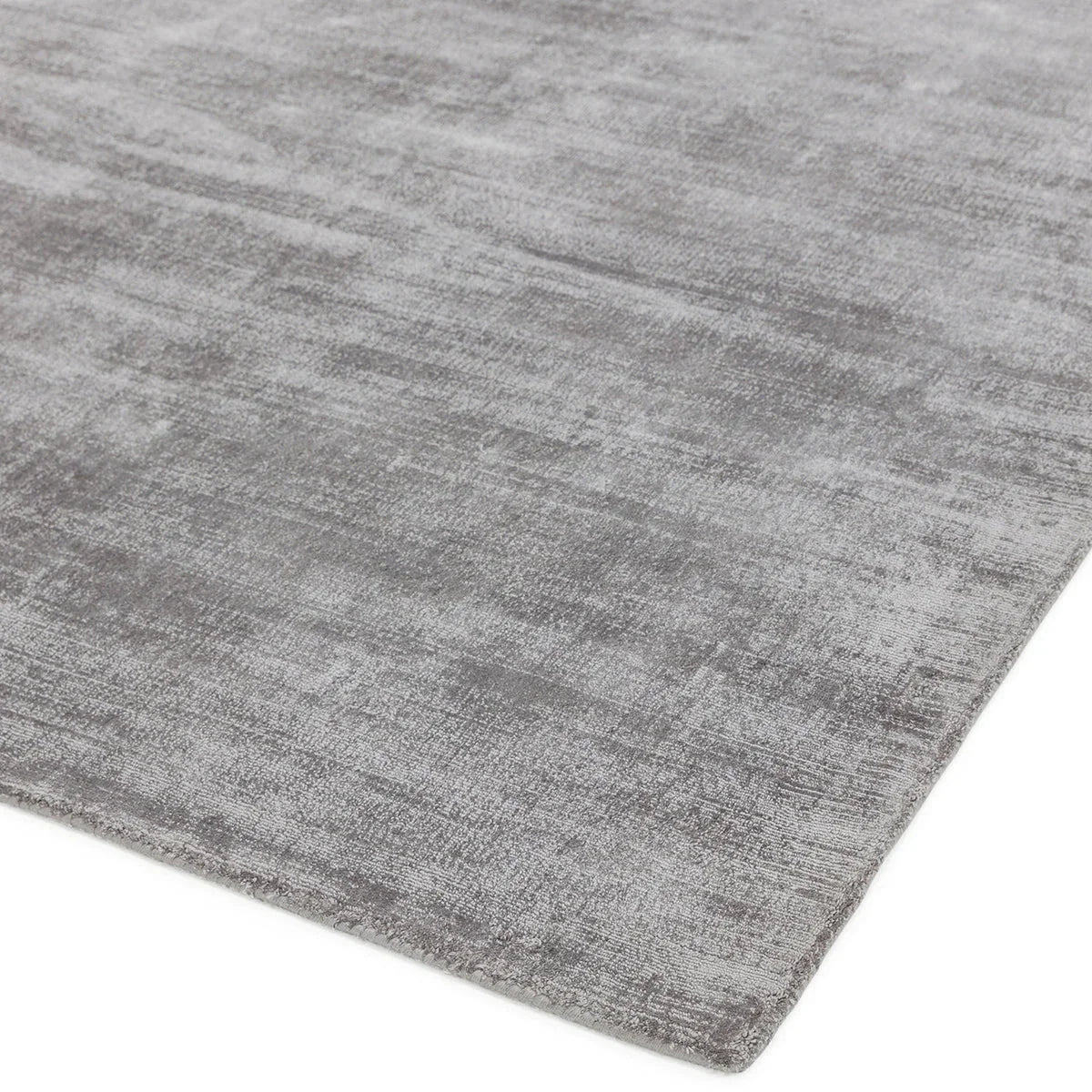 Asiatic Blade Silver Designer Rug featuring distressed silver-grey pattern on white background, machine-made synthetic