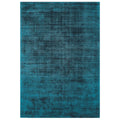 Asiatic Blade Teal rectangle rug styled in a living room