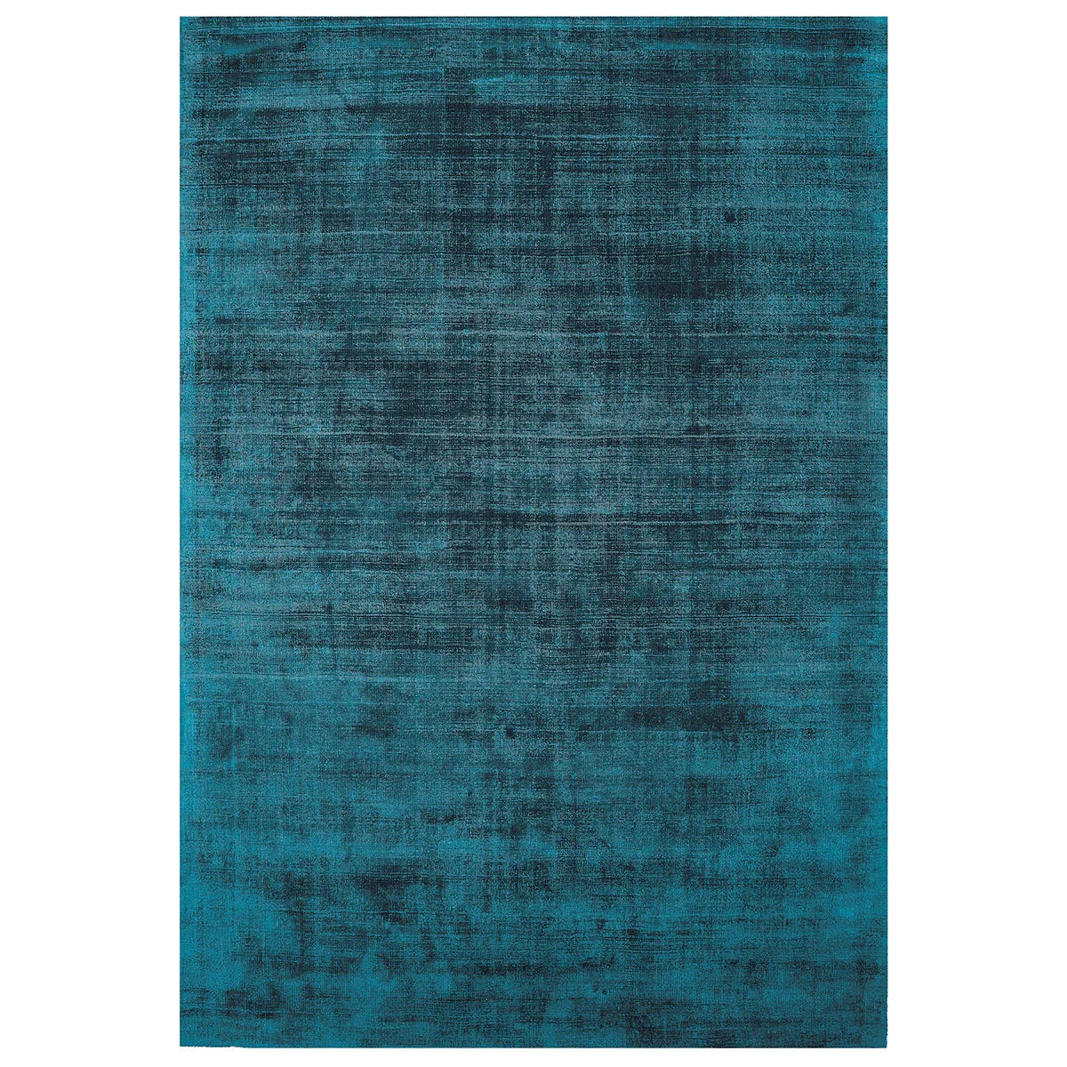 Asiatic Blade Teal rectangle rug styled in a living room