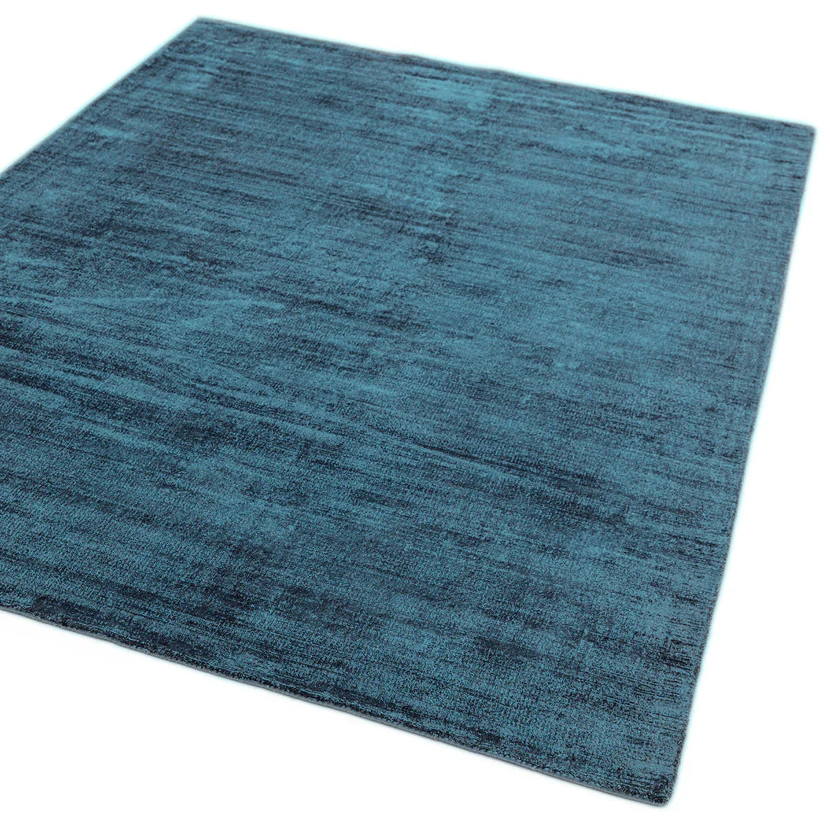 Asiatic Blade Teal Designer Rug featuring distressed teal texture in teal hues on white background, machine-made fibres