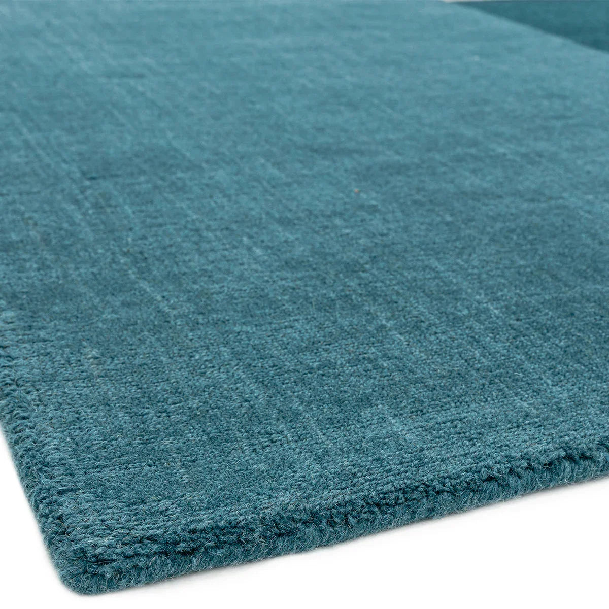 Asiatic Blox Teal Designer Rug featuring textured teal, turquoise and blue-green on white background, hand-tufted wool