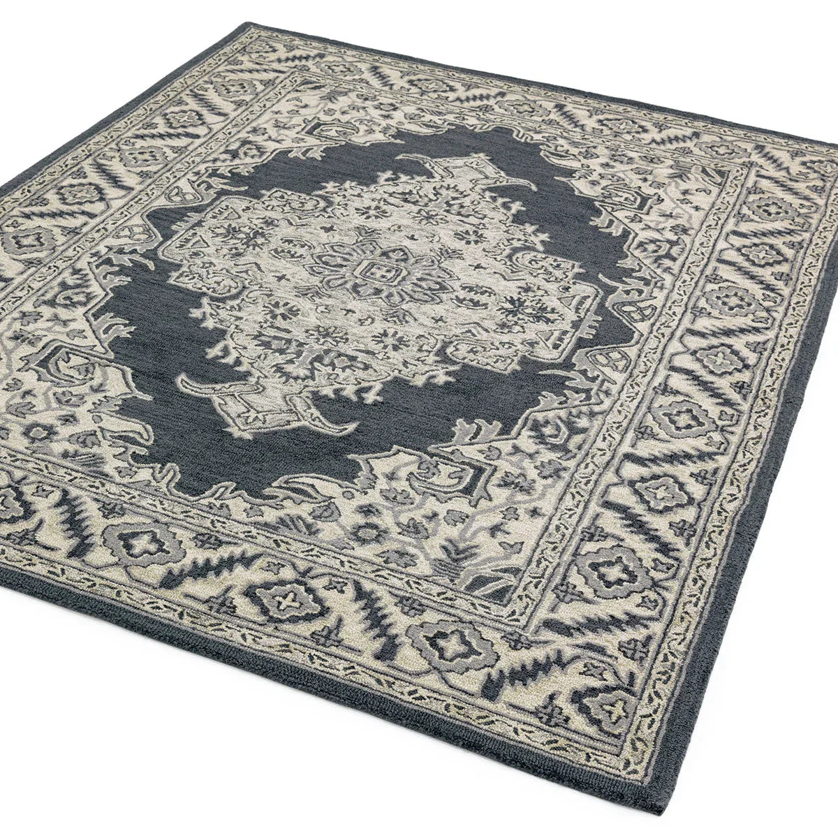 Asiatic Bronte Shadow Designer Rug featuring medallion pattern in navy blue and ivory on light beige, hand-tufted wool