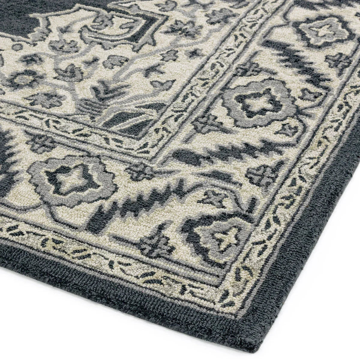 Asiatic Bronte Shadow Designer Rug featuring oriental medallion in navy blue, charcoal, ivory and grey on ivory woven wool