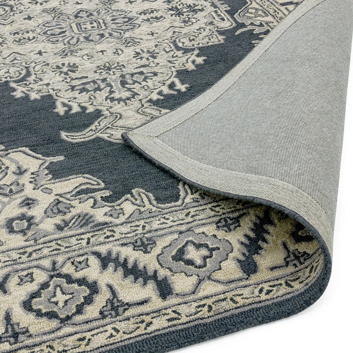 Asiatic Bronte Shadow Designer Rug featuring medallion navy blue, ivory and grey on navy background, machine-woven wool