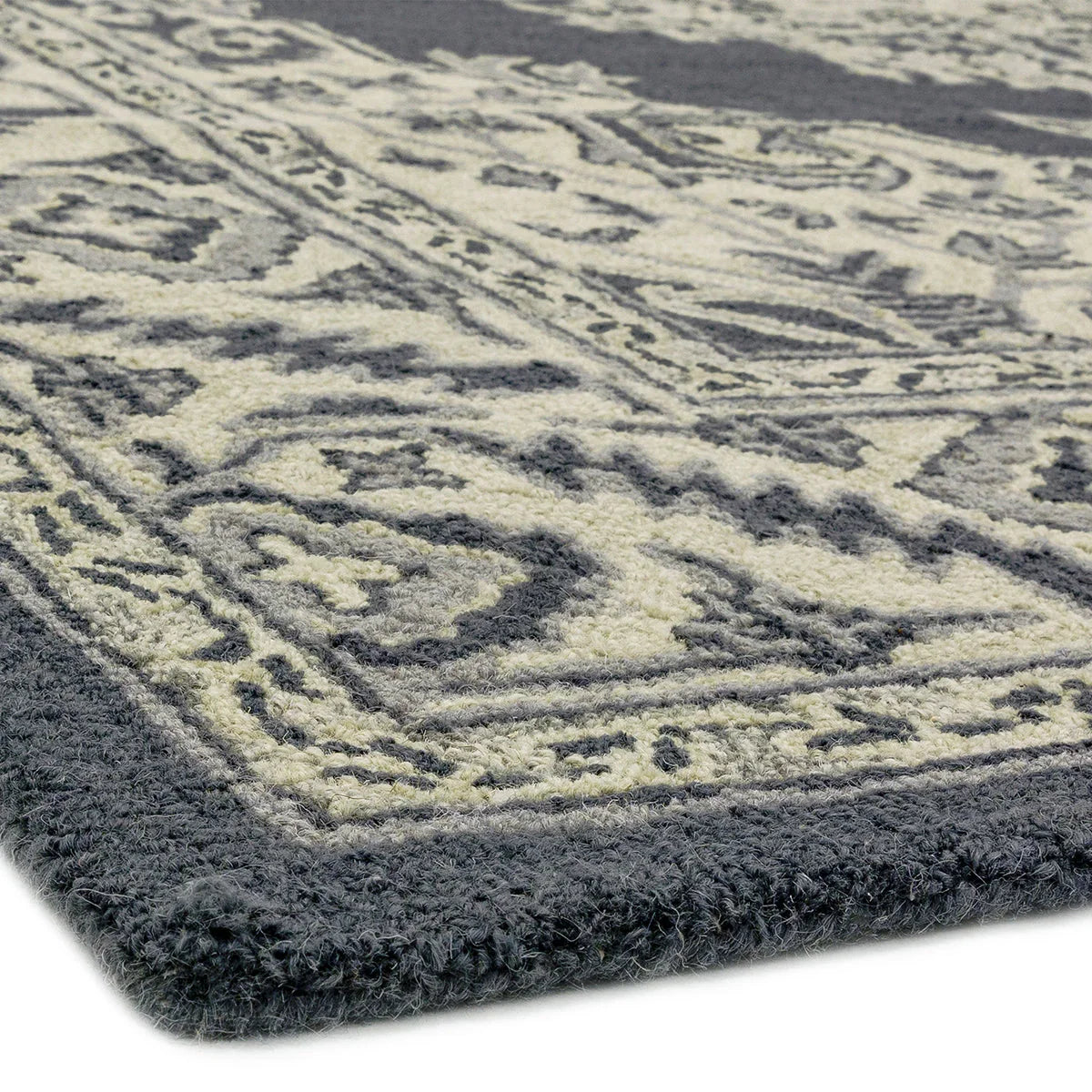 Asiatic Bronte Shadow Rug featuring damask pattern in navy blue, cream & gray on charcoal background, machine-made wool
