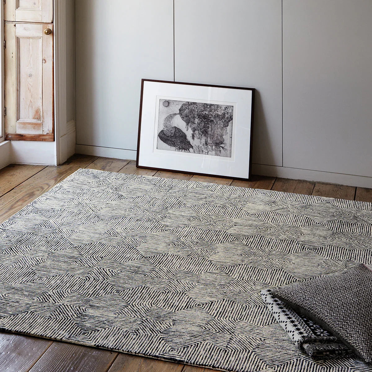 Asiatic Camden Black/White Designer Rug featuring geometric pattern in black and white on cream background, woven wool