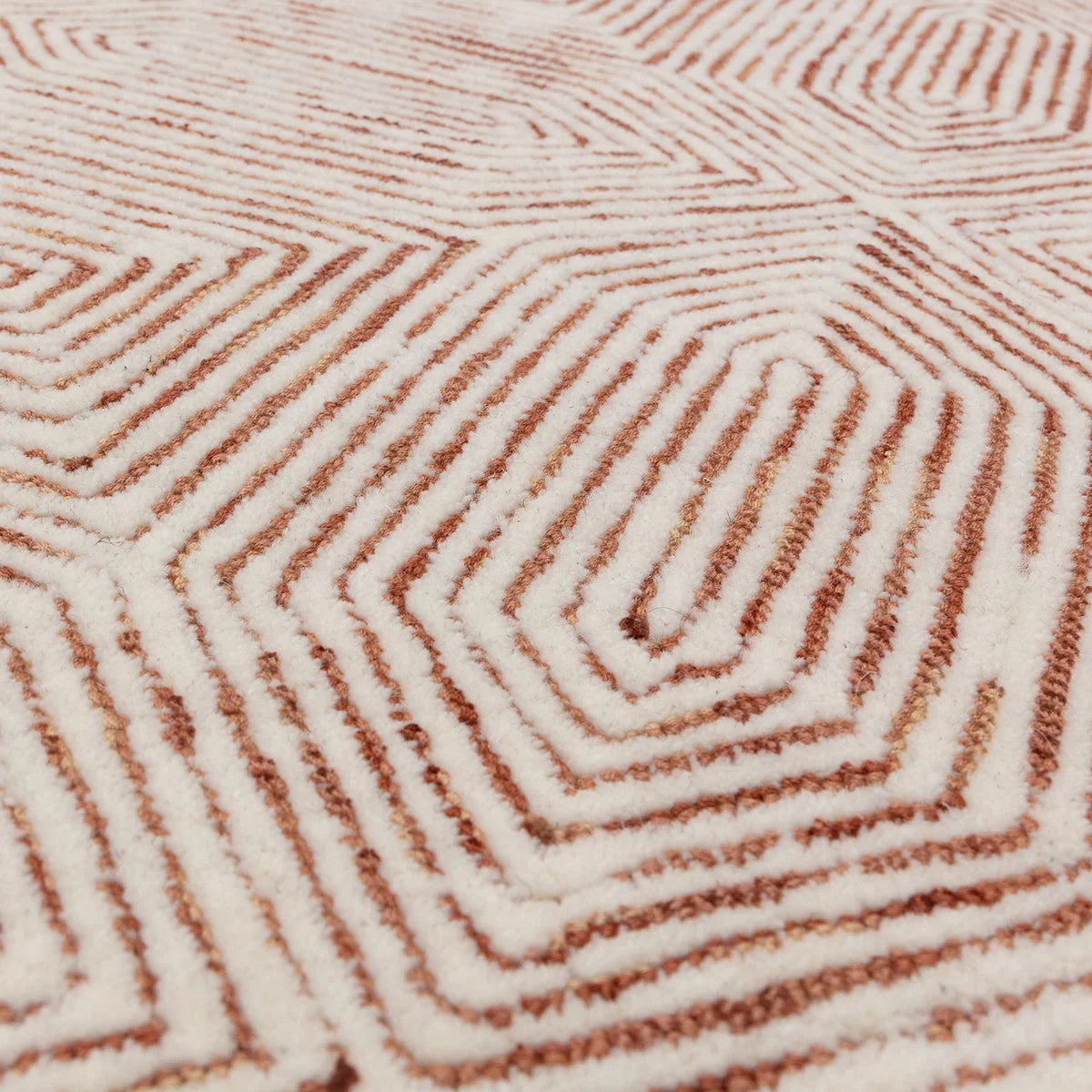 Asiatic Camden Terracotta rug with geometric labyrinth pattern in terracotta and cream on ivory background, tufted wool