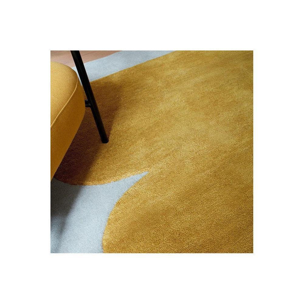 Asiatic Sculpt Gold Designer Rug featuring abstract sculptural pattern in gold and pale blue on light blue background