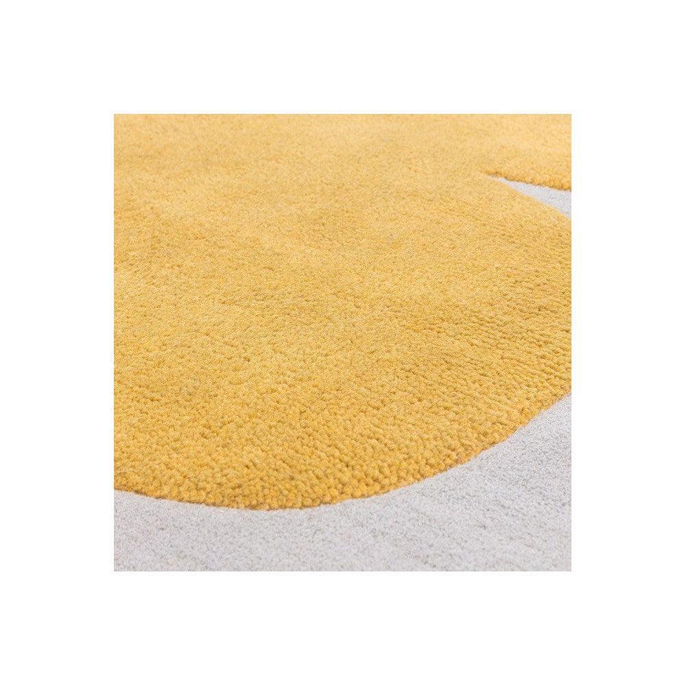 Asiatic Sculpt Gold Designer Rug featuring shag texture in mustard gold on light grey background, hand-tufted wool