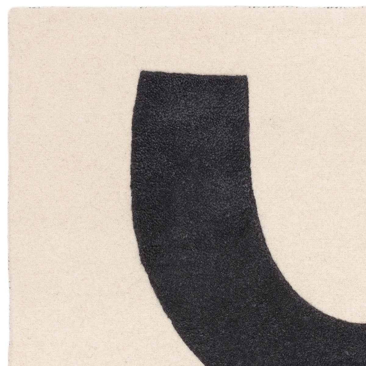 Asiatic Canvas 03 Balance Rug featuring abstract curved motif in charcoal, ivory on beige background, machine-woven wool