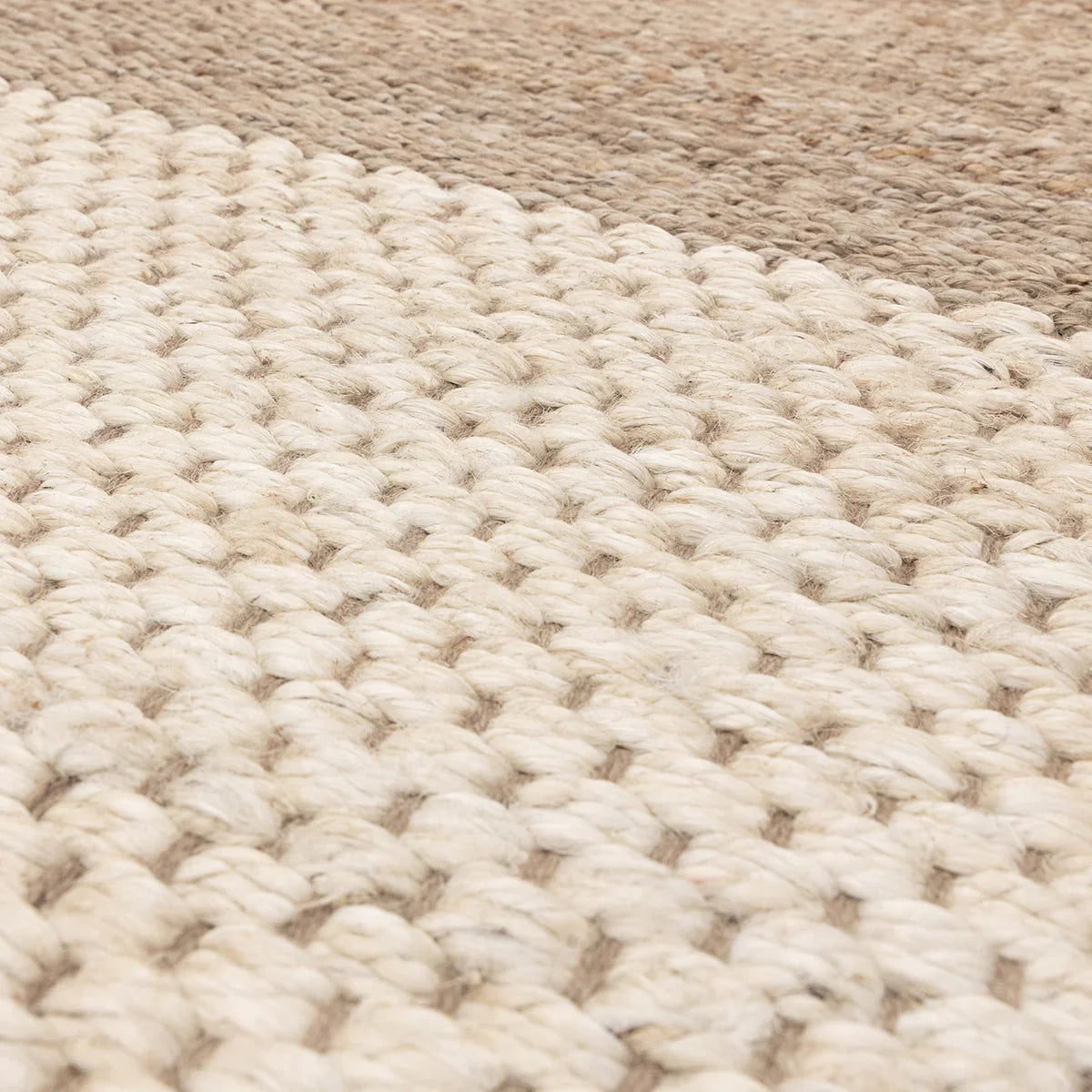 Asiatic Cedar Ivory Natural Rug featuring chunky loop weave in ivory, cream and beige on tan background, tufted wool