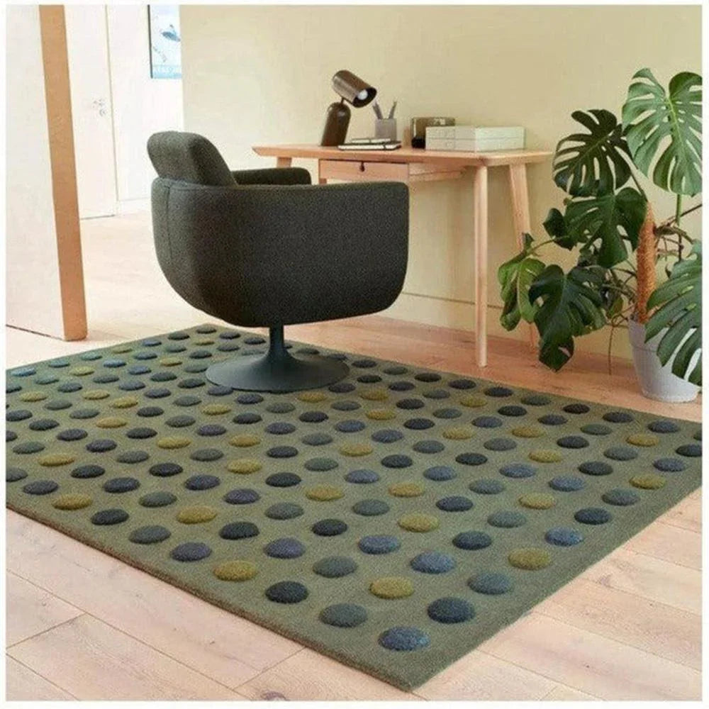 Asiatic Dotty Green Rug featuring polka dots in navy, teal, olive and mustard on sage-green background, machine-made polyester