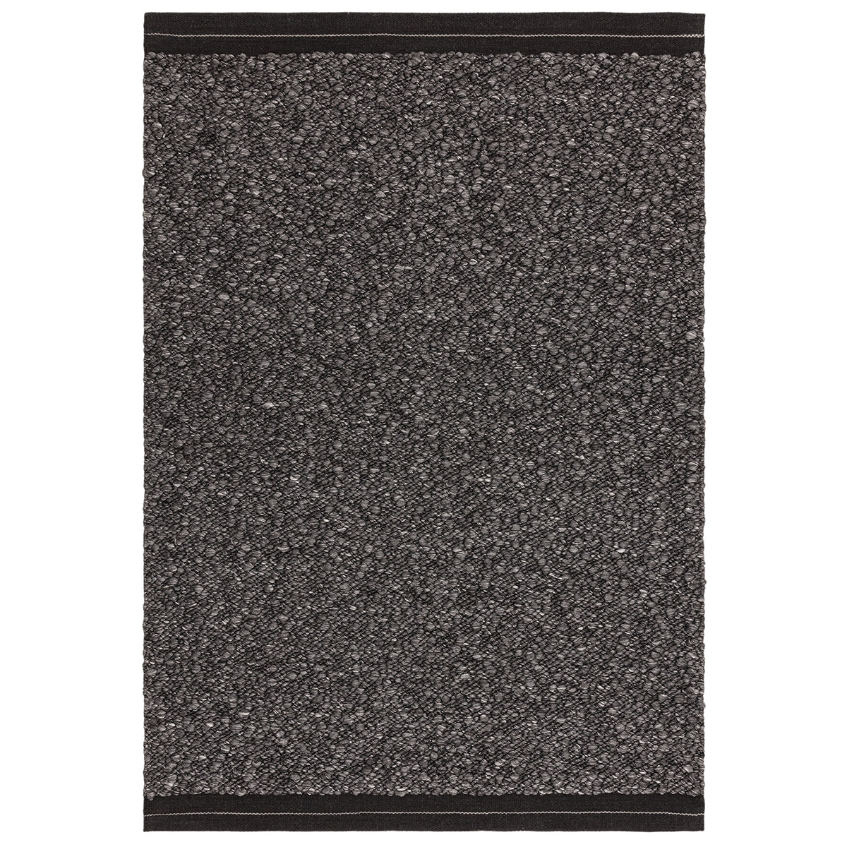 Textured black doormat on a white background