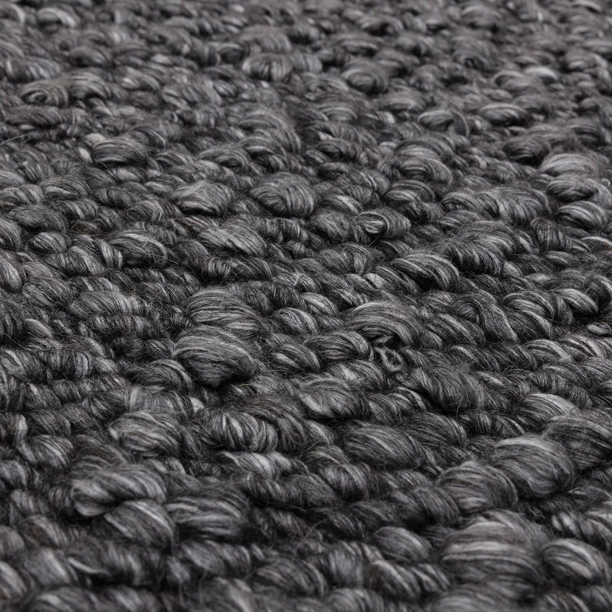 Asiatic Elm Charcoal Designer Rug featuring looped texture in charcoal grey, black and gunmetal on charcoal background, hand-tufted wool