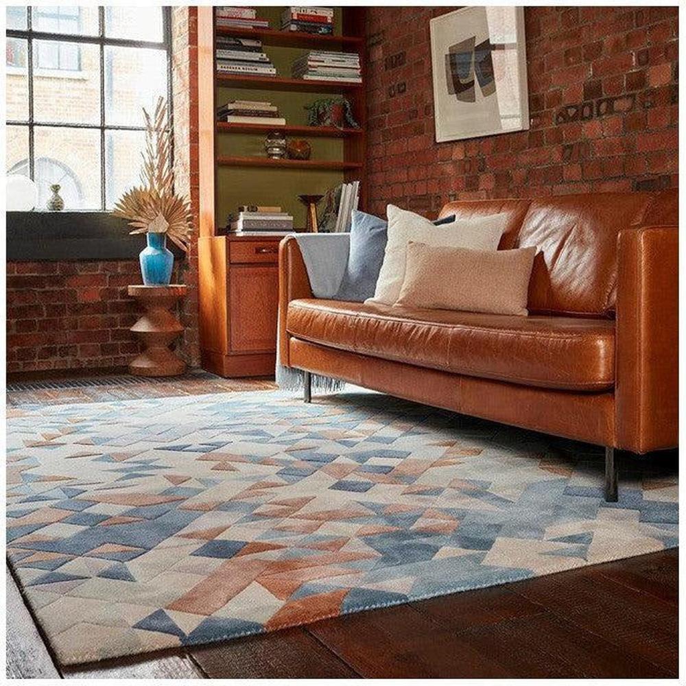 Asiatic Enigma Blue Designer Rug featuring geometric triangle pattern in azure blue, navy and beige on ivory background, hand-tufted wool