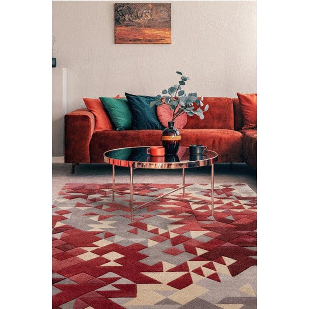 Asiatic Enigma Red Designer Rug featuring geometric triangle pattern in crimson red, burgundy, cream on light grey background, hand-tufted wool