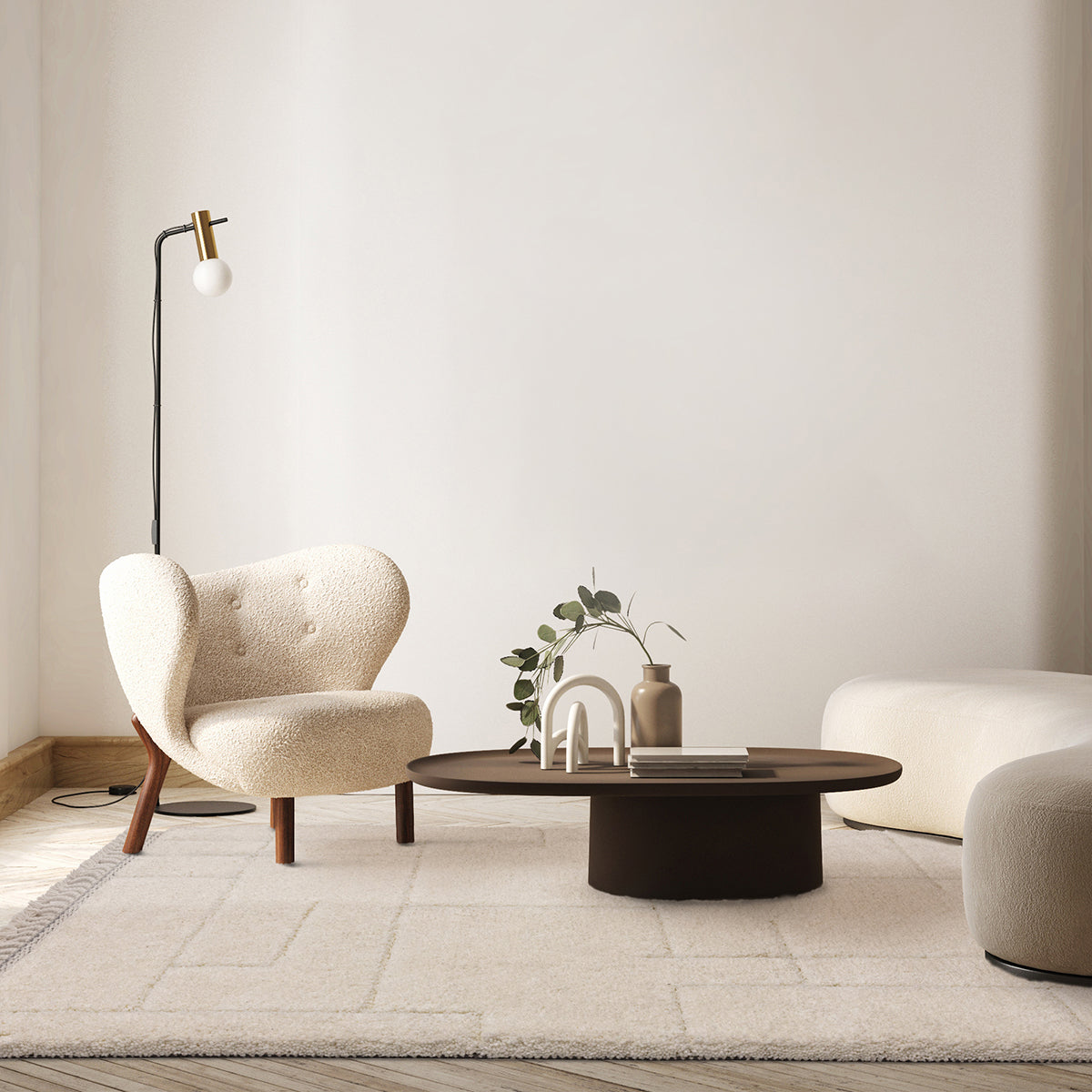 Modern living room with a beige armchair, round coffee table, and minimal decor.