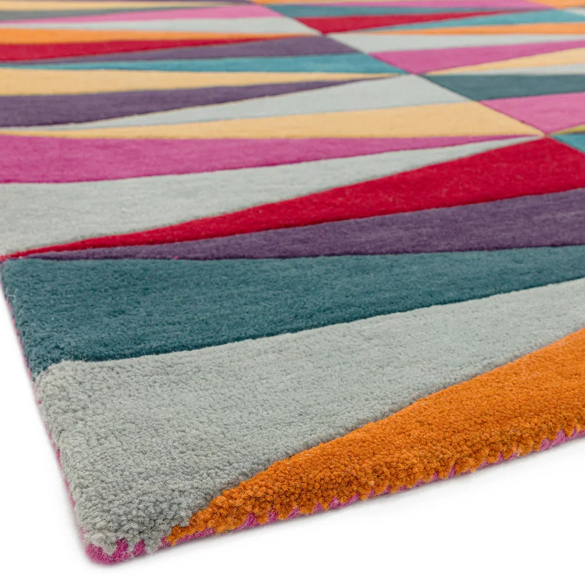 Asiatic Funk Triangles rug featuring geometric triangle pattern in pink, teal, orange, purple on light grey background, hand-tufted wool