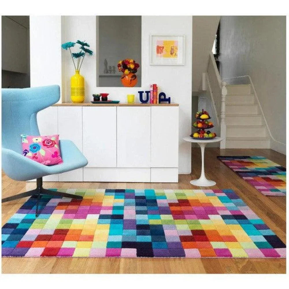 Asiatic Funk Multi Designer Rug featuring vibrant patchwork geometry in pink, magenta, yellow, teal, blue on white background, hand-tufted wool