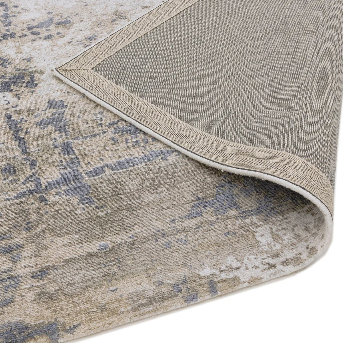 Asiatic Gatsby Cloud Designer Rug featuring distressed abstract pattern in dusty blue, taupe and ivory on beige background, machine-made polypropylene