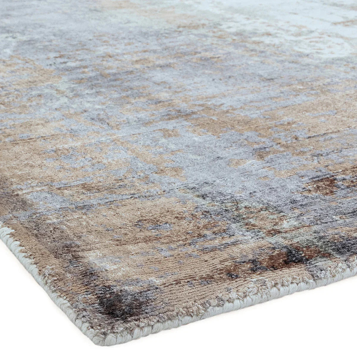 Asiatic Gatsby Coral Designer Rug featuring abstract distressed pattern in coral, blue-grey and beige on pale blue background, hand-tufted wool