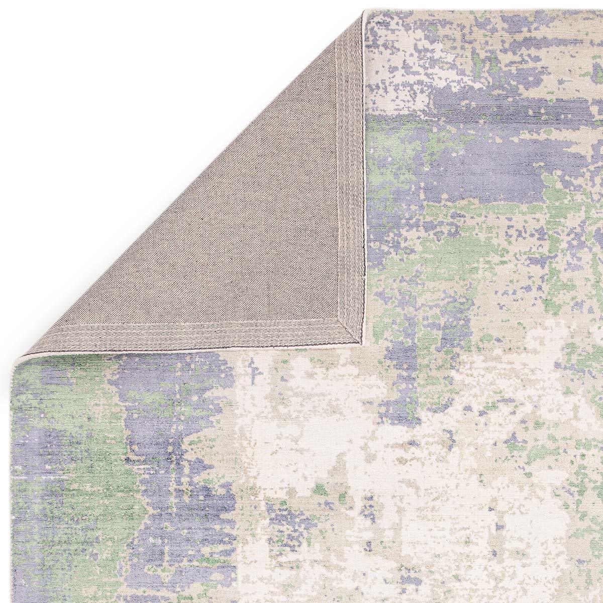 Asiatic Gatsby Green rug featuring abstract distressed pattern in emerald green, lavender, sage and cream on ivory, hand-tufted wool