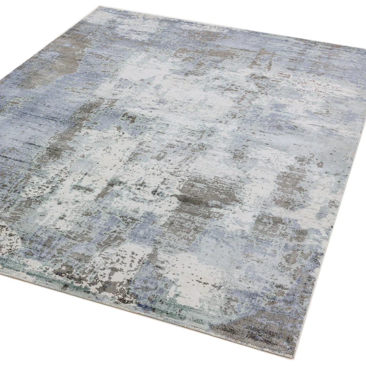 Asiatic Gatsby Navy Designer Rug featuring abstract distressed pattern in navy, blue-grey, beige and cream on pale grey background, hand-tufted wool