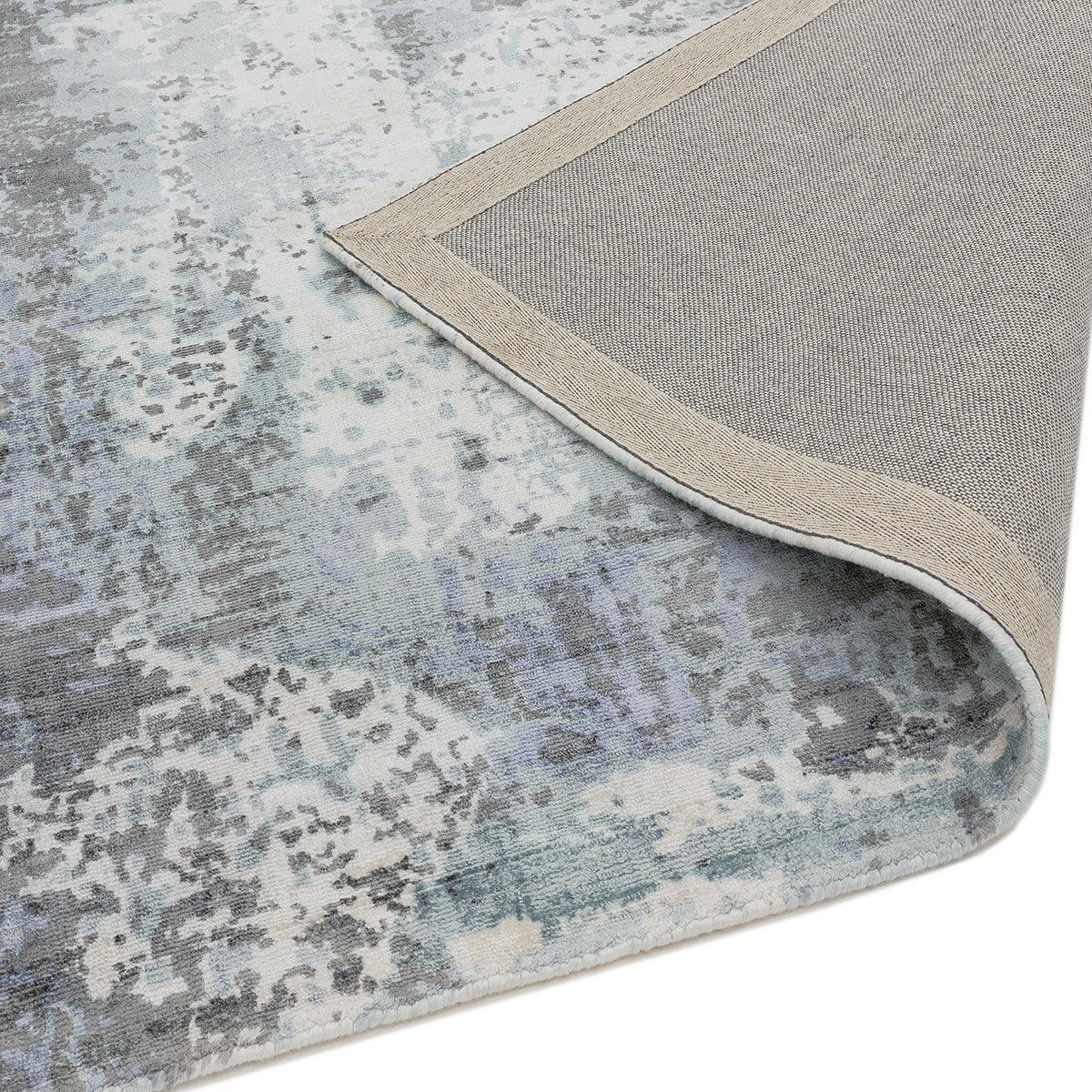 Asiatic Gatsby Navy Designer Rug featuring abstract distressed pattern in navy, blue-grey and cream on light beige, hand-tufted wool