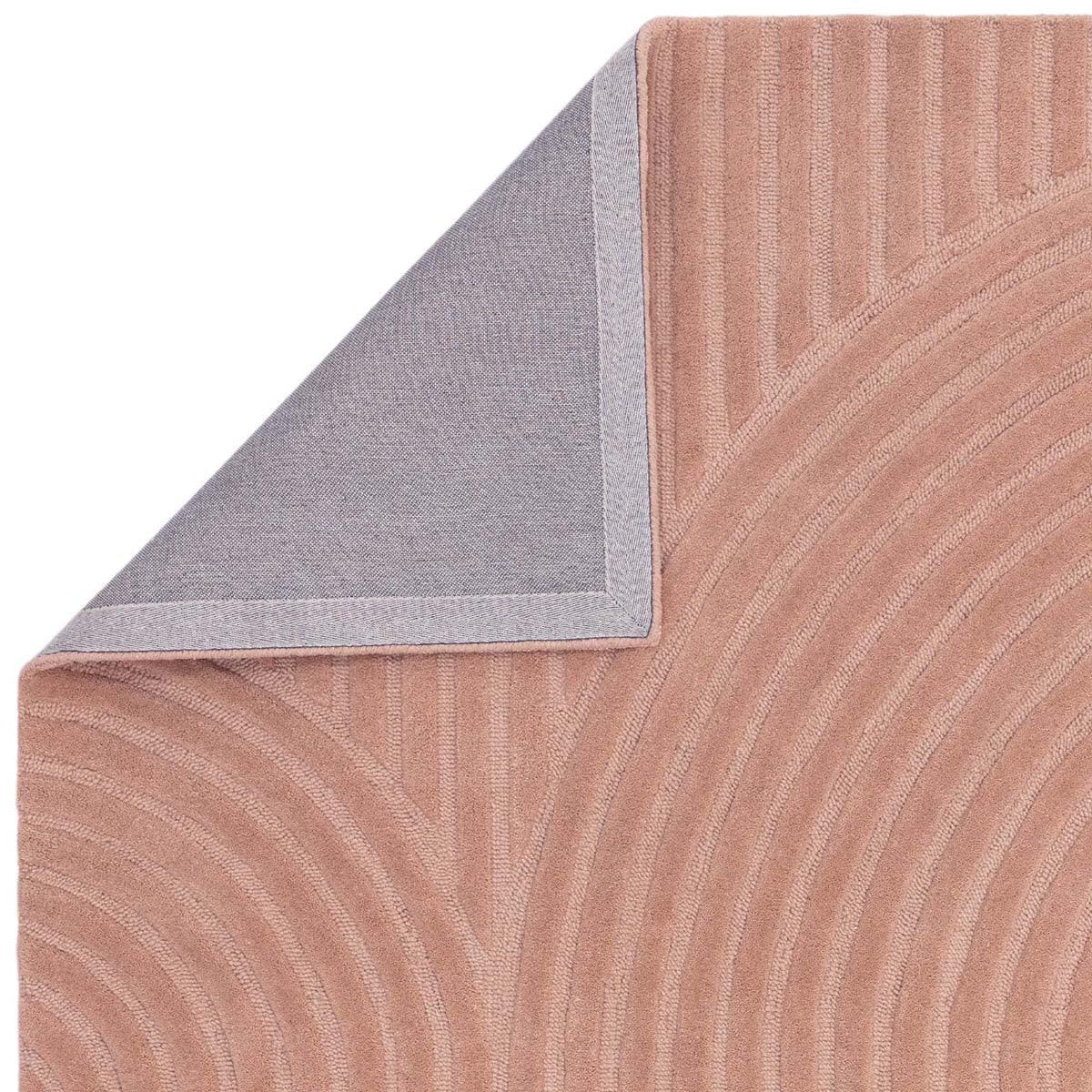 Asiatic Hague Blush Designer Rug featuring curved stripe pattern in blush pink, dusty rose and grey on pale grey background, hand-tufted wool