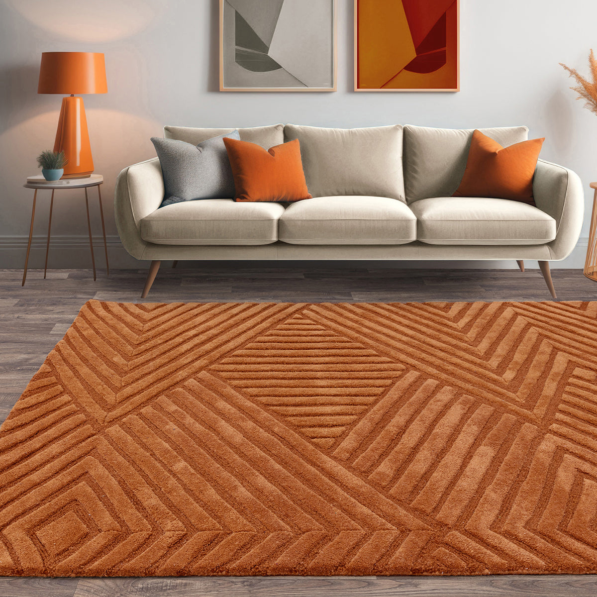 Living room with a beige sofa, orange pillows, and a geometric-patterned orange rug.