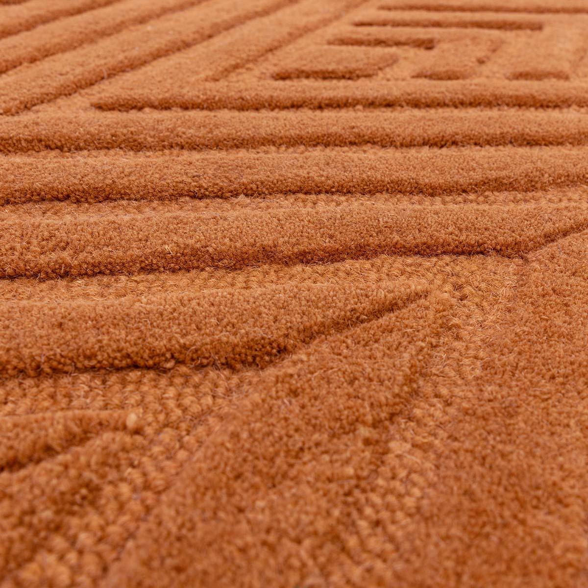 Asiatic Hague Desert Designer Rug featuring striped ribbed pattern in burnt orange on warm terracotta background, hand-tufted wool