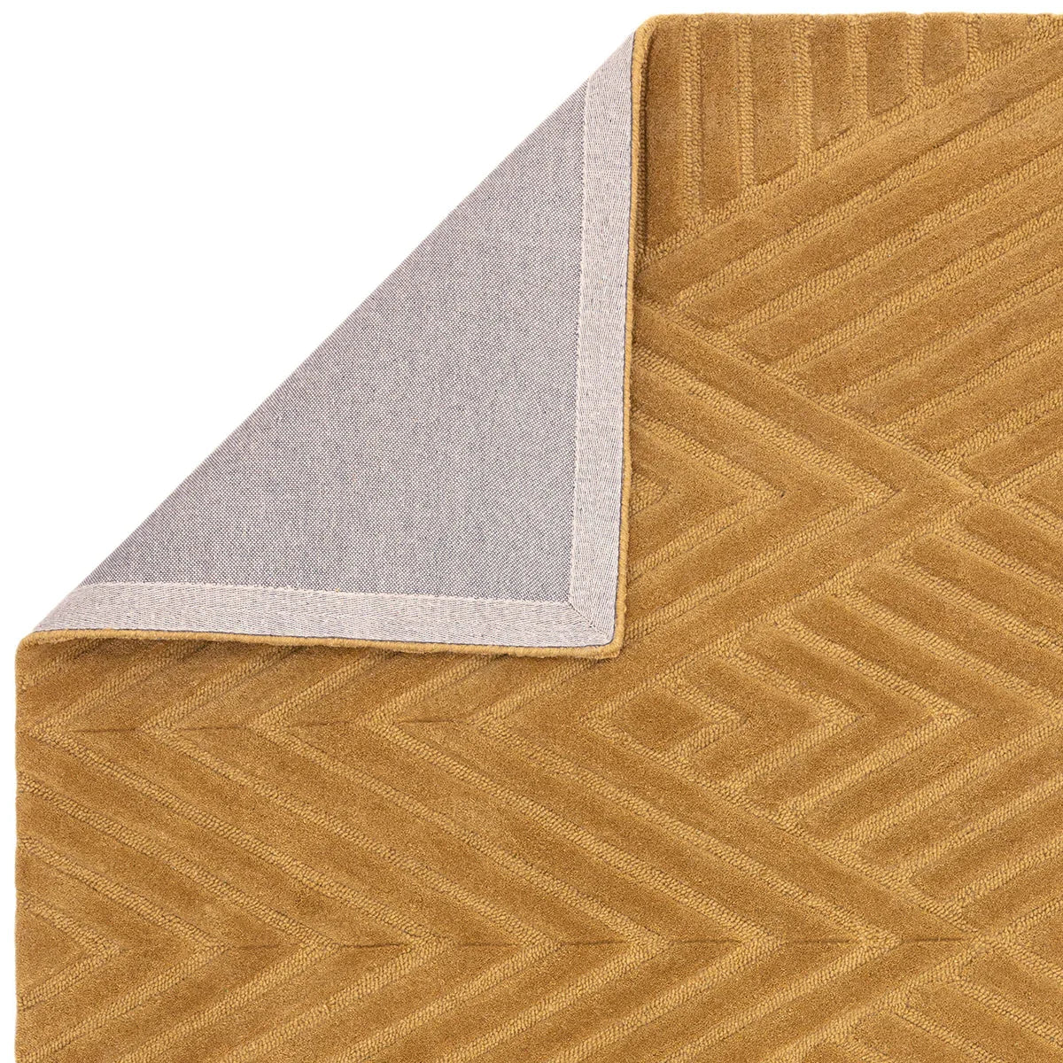 Asiatic Hague Ochre Designer Rug featuring chevron pattern in ochre and pale grey on warm ochre ground, hand-tufted wool