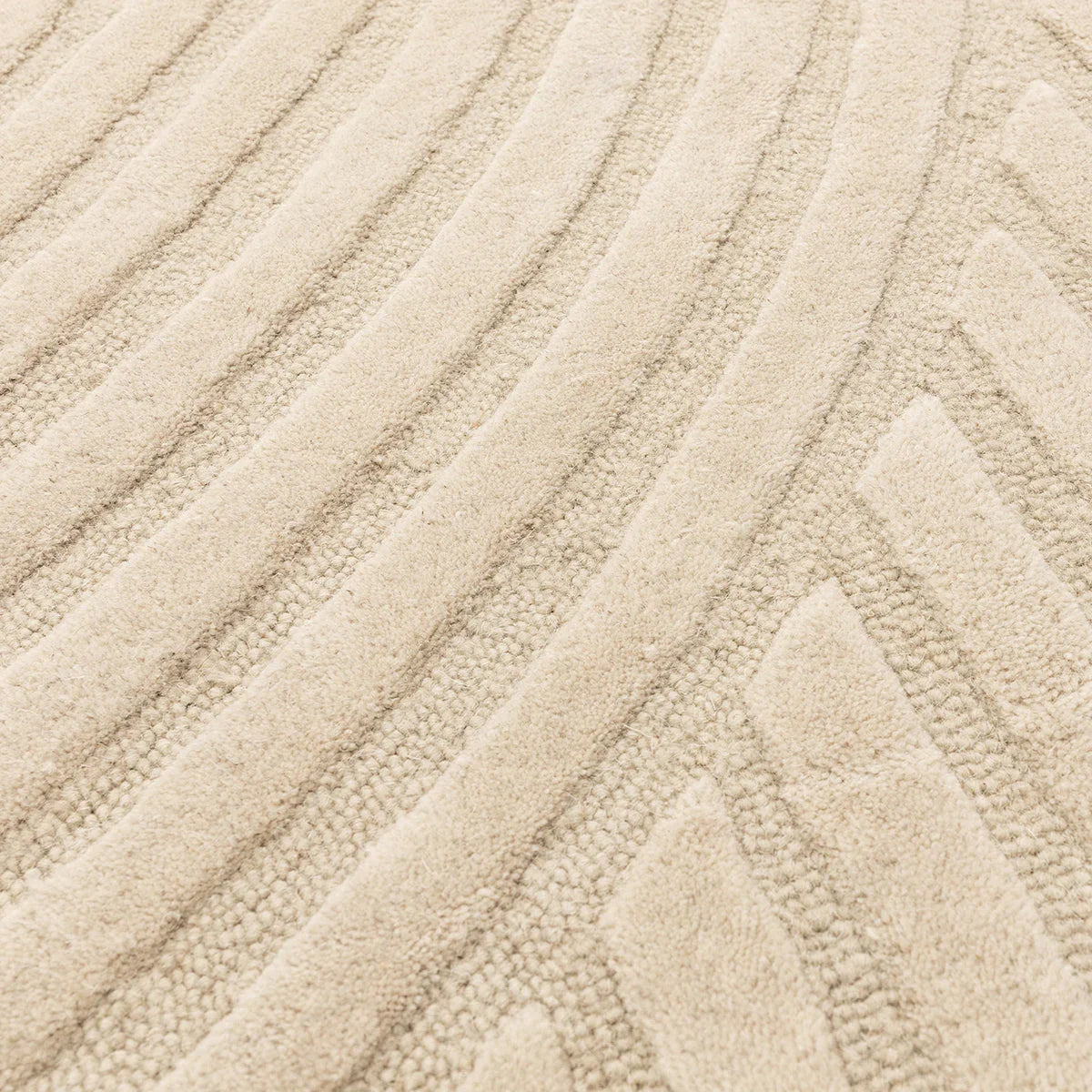 Asiatic Hague Sand Designer Rug featuring geometric chevron pattern in sand, cream and taupe on beige background, hand-tufted wool