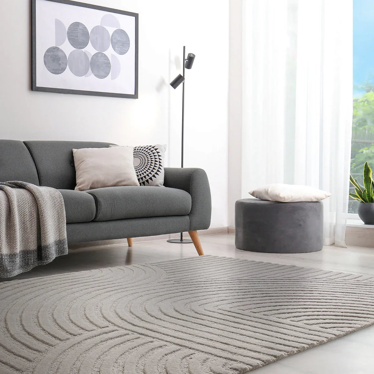 Asiatic Hague Silver Designer Rug featuring circular line pattern in silver, grey, ivory on cream background, hand-tufted wool