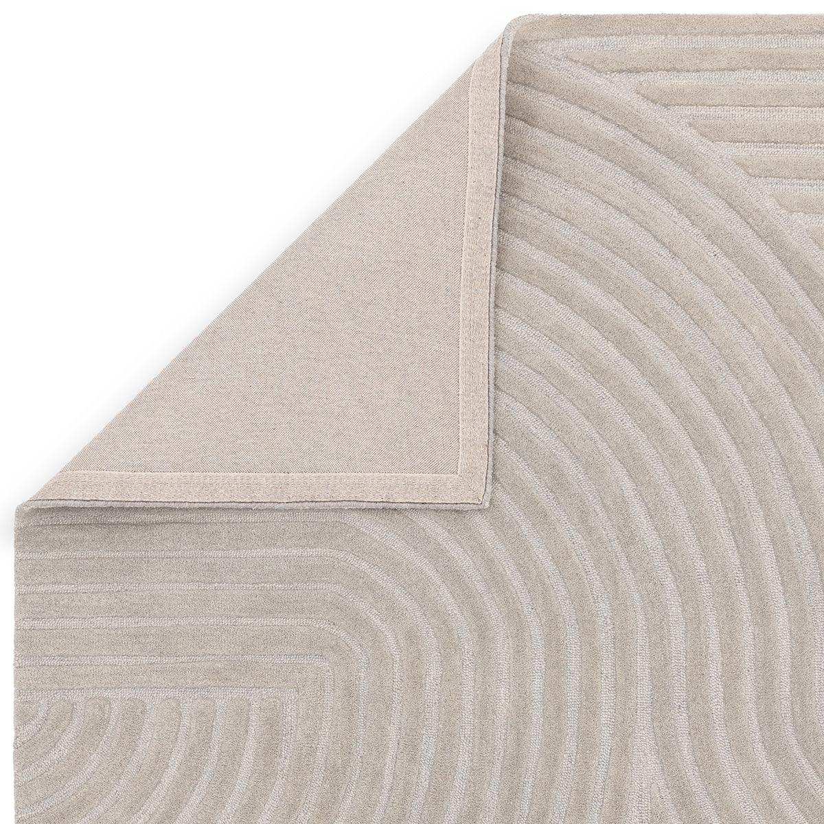 Asiatic Hague Silver Designer Rug featuring concentric curved pattern in silver-grey, taupe and beige on light beige background, hand-tufted wool
