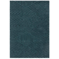 Teal rug with geometric pattern on a white background