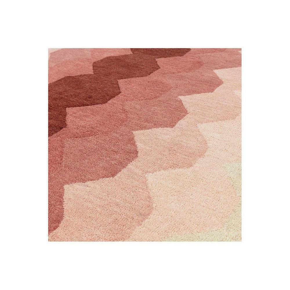 Asiatic Hive rug featuring honeycomb pattern in rose pink, dusty pink, blush and cream on pale beige, hand-tufted wool