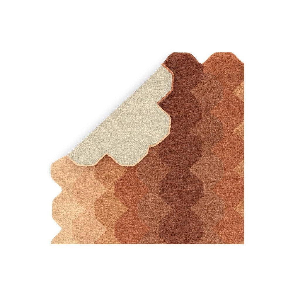 Asiatic Hive Rust Designer Rug featuring honeycomb pattern in beige, tan, and rust on warm rust background, hand-tufted wool