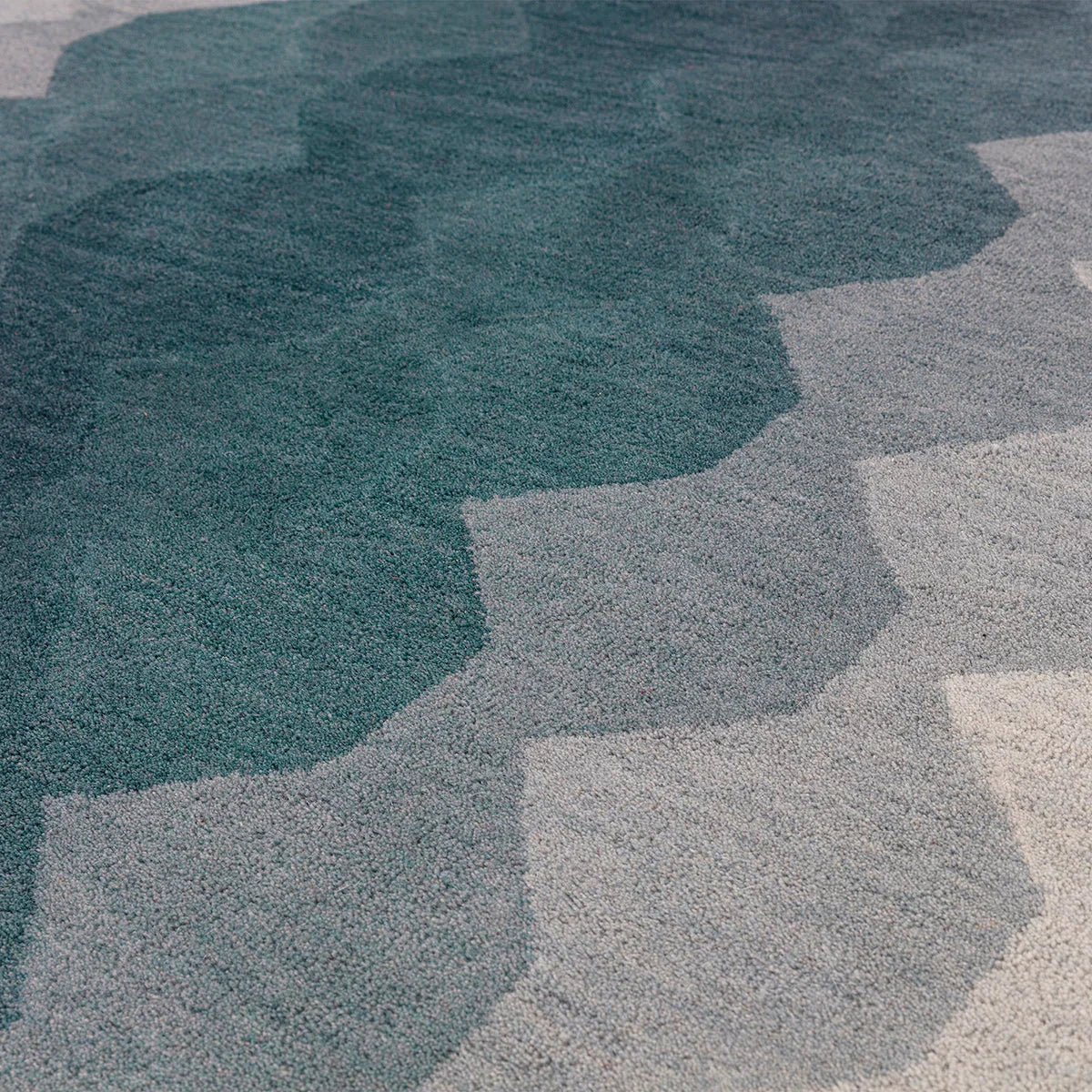 Asiatic Hive Teal Runner featuring hive pattern in teal, deep teal, grey and cream on cream background, hand-tufted wool