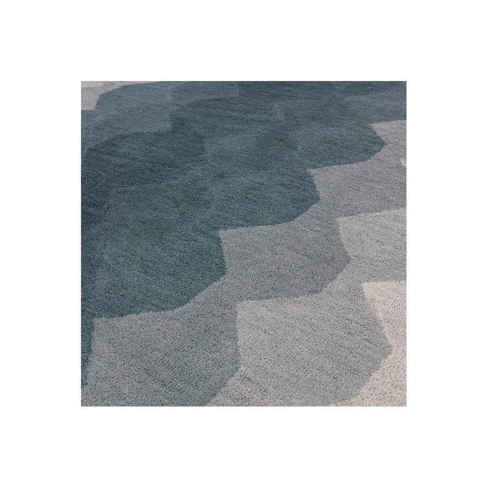 Asiatic Hive Teal Designer Rug featuring hexagonal hive pattern in teal, slate blue, light grey and beige on light grey background, machine-made polypropylene