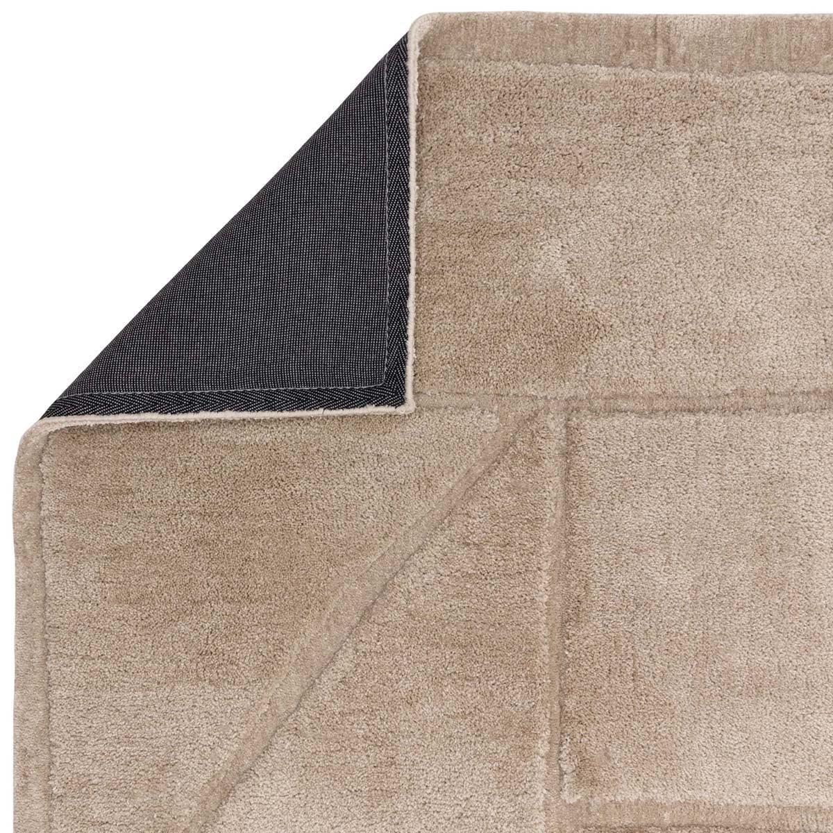 Asiatic Horizon Sand Designer Rug featuring geometric patchwork in sand beige and navy on pale beige, machine-made wool