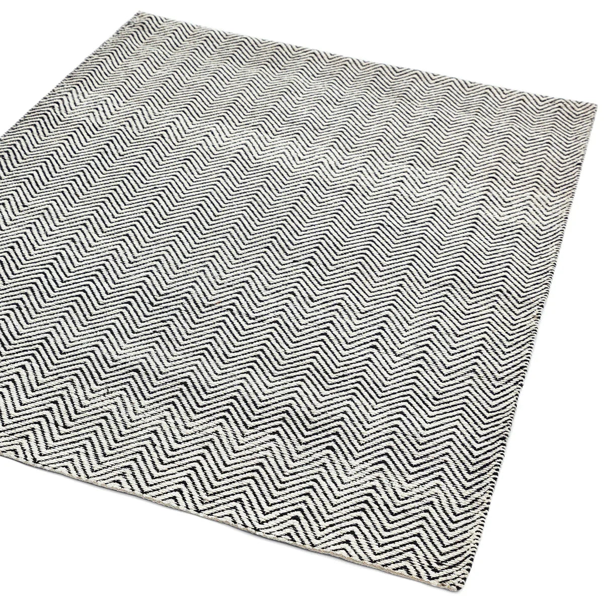 Asiatic Ives Black White Designer Rug featuring chevron pattern in black and white on white background, hand-tufted wool