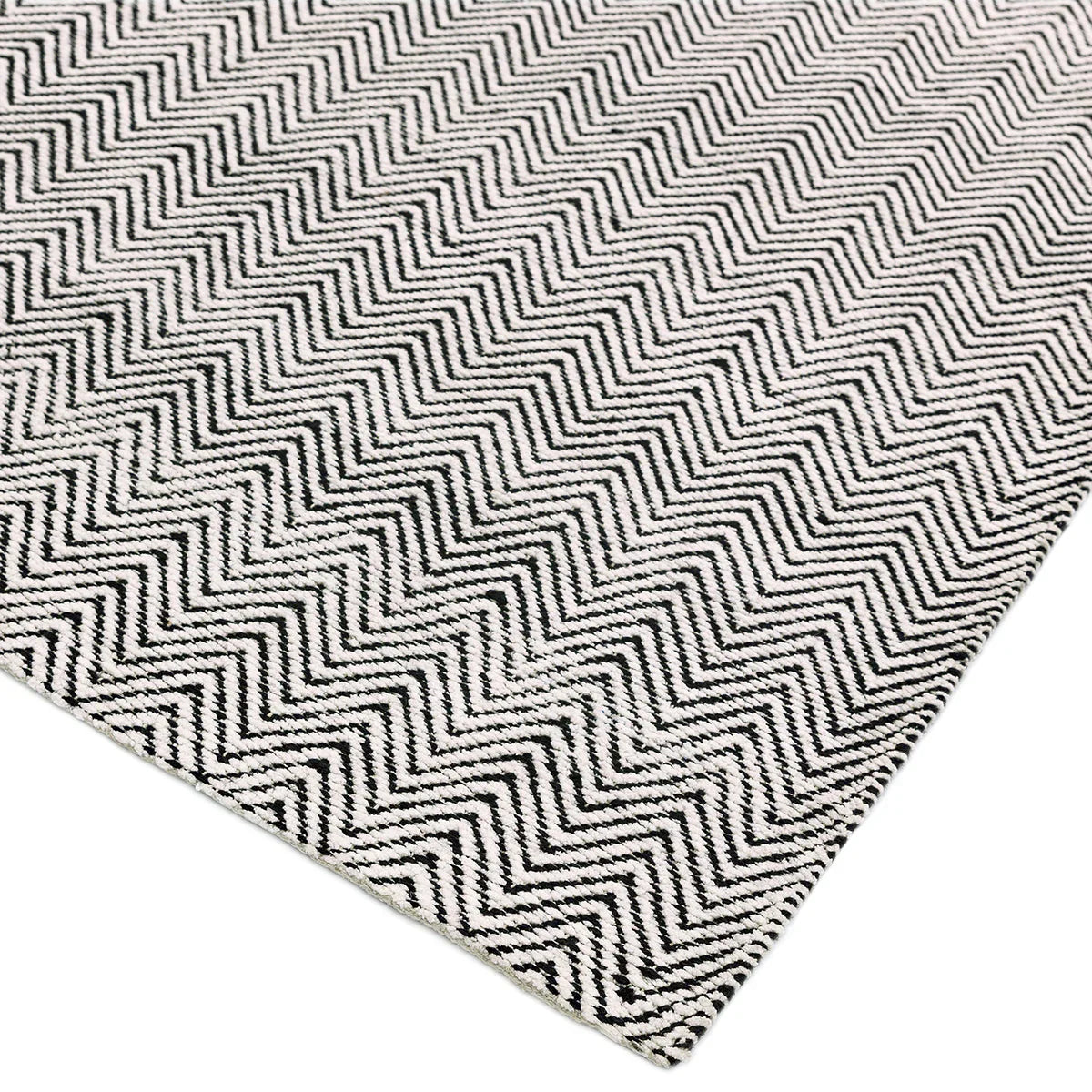 Asiatic Ives Black White Designer Rug featuring chevron pattern in black and white on white background, hand-tufted wool