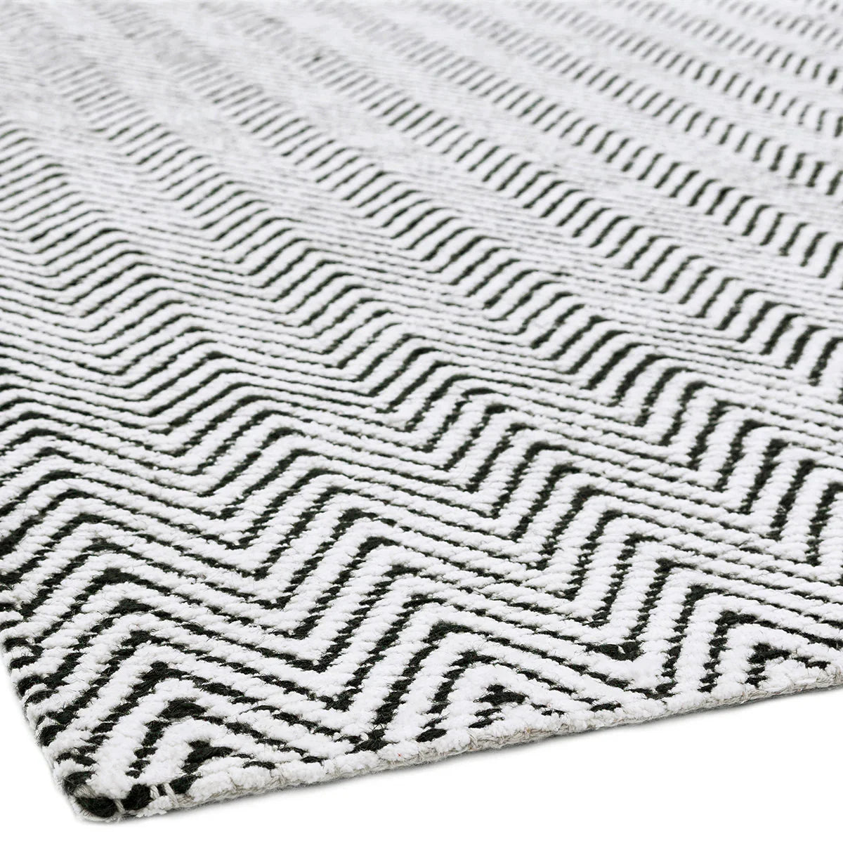 Asiatic Ives Black White Designer Rug featuring bold geometric chevron pattern in black and white on ivory background