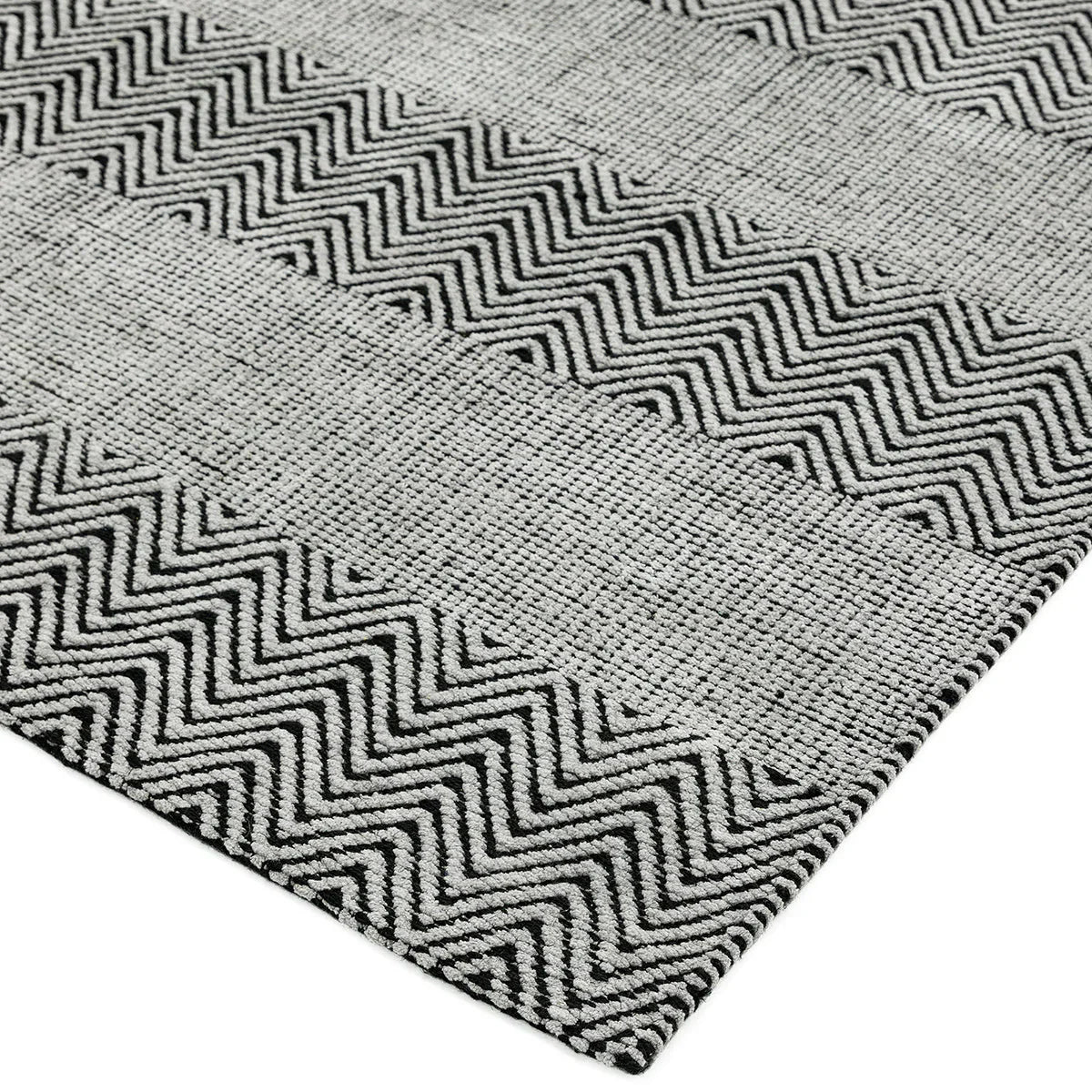 Asiatic Ives Grey Designer Rug featuring chevron/zigzag pattern in charcoal, dark grey, light grey on grey background, machine-woven wool