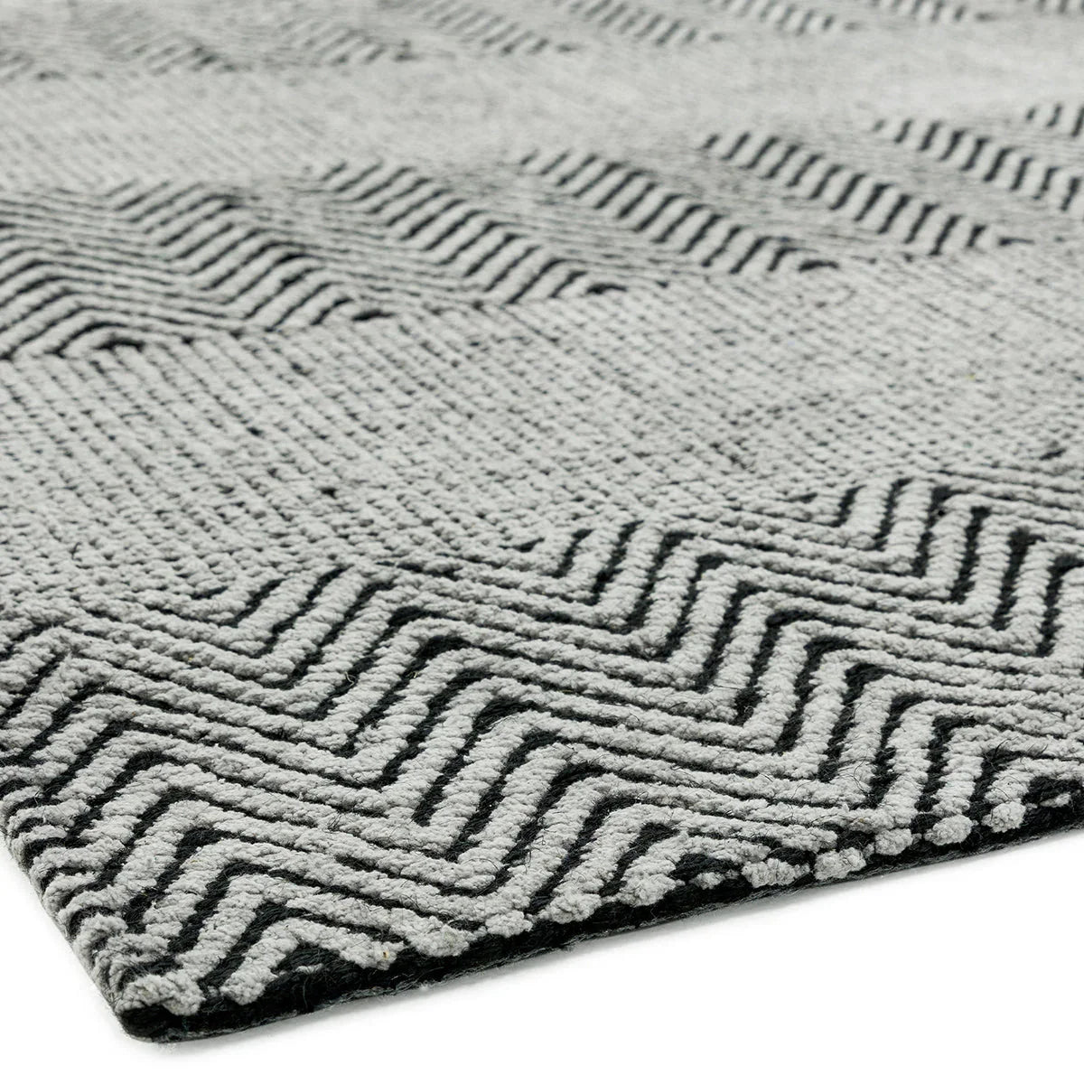 Asiatic Ives Grey Designer Rug featuring geometric maze pattern in charcoal black and light grey on pale grey background, hand-tufted wool