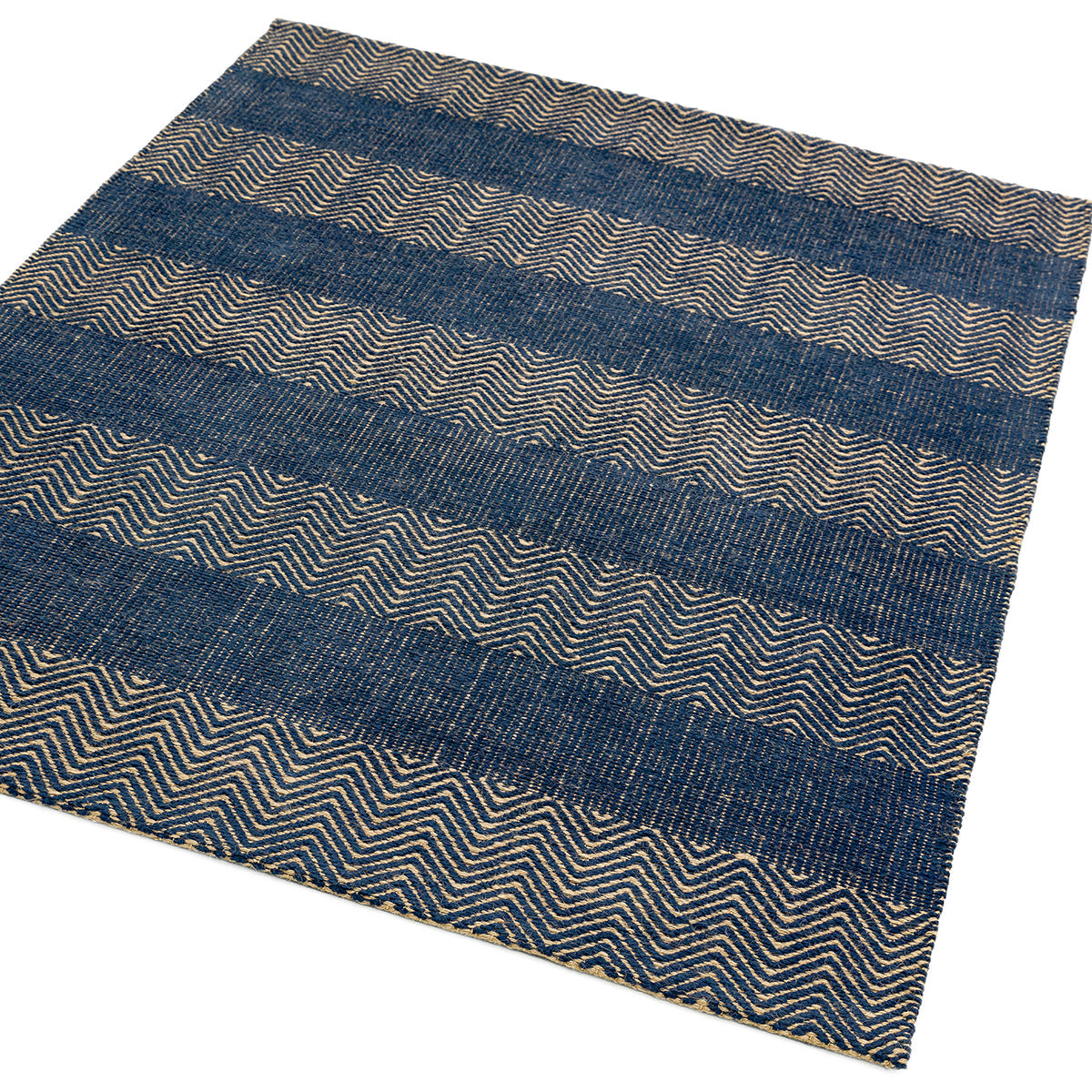 Textured blue and beige rug with wavy pattern on a white background