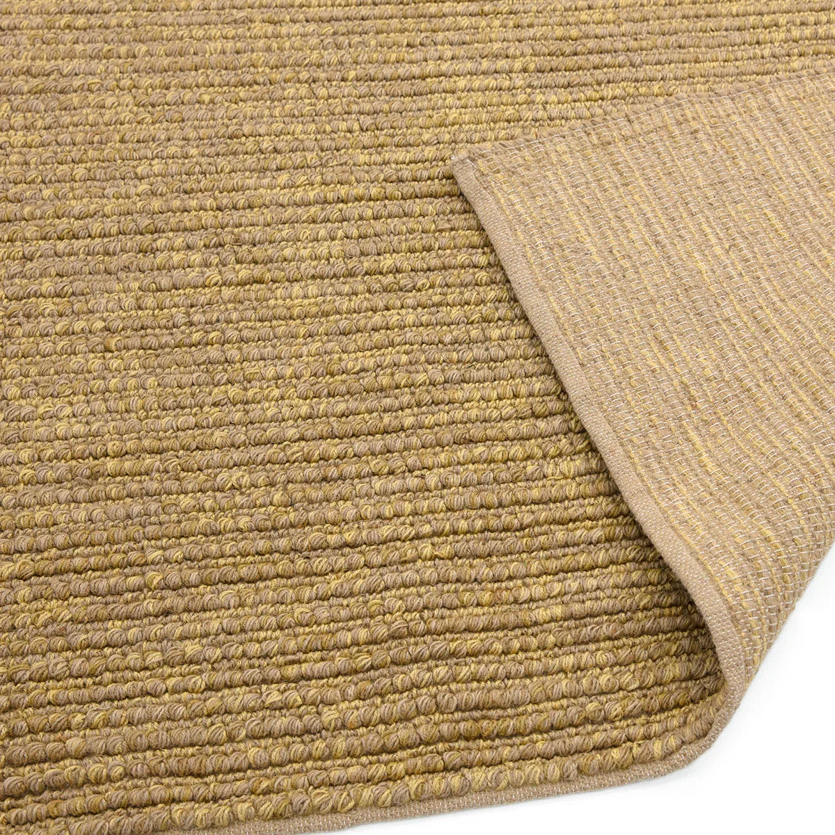Asiatic Jute Loop Natural Rug featuring woven loop texture in natural beige, tan and sandy on warm beige background, hand-woven jute