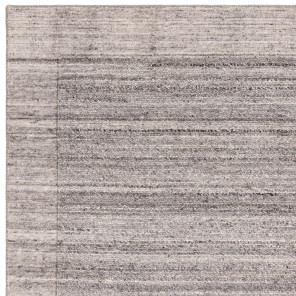 Asiatic Larson Charcoal Designer Rug featuring subtle striped abstract pattern in charcoal, grey, taupe on light beige background, machine-made wool blend