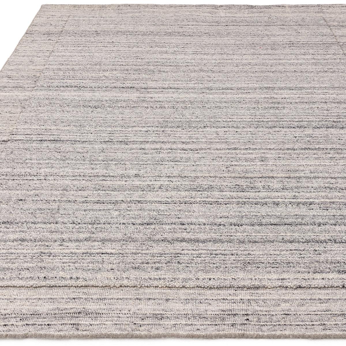 Asiatic Larson Grey Designer Rug featuring subtle linear stripes in dark and light greys on pale grey background, machine-made wool